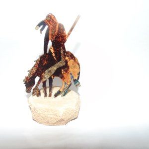 METAL SCULPTURE ON SAND STONE